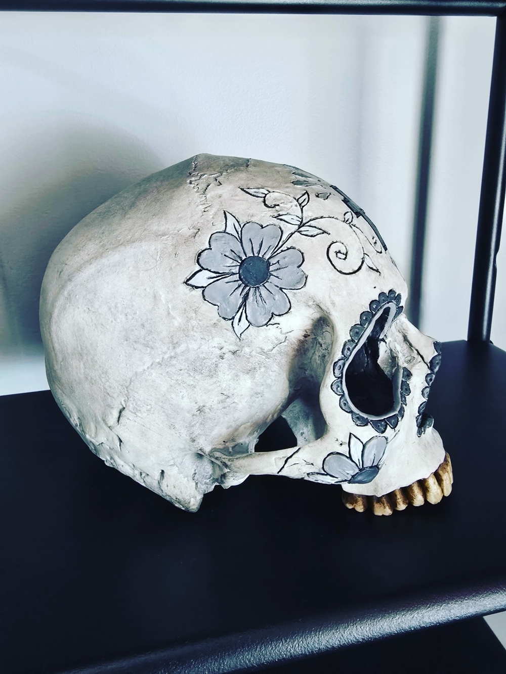 Hand-Painted White Ceramic Skull Sculpture with Blue Accents - Picture 2 of 2